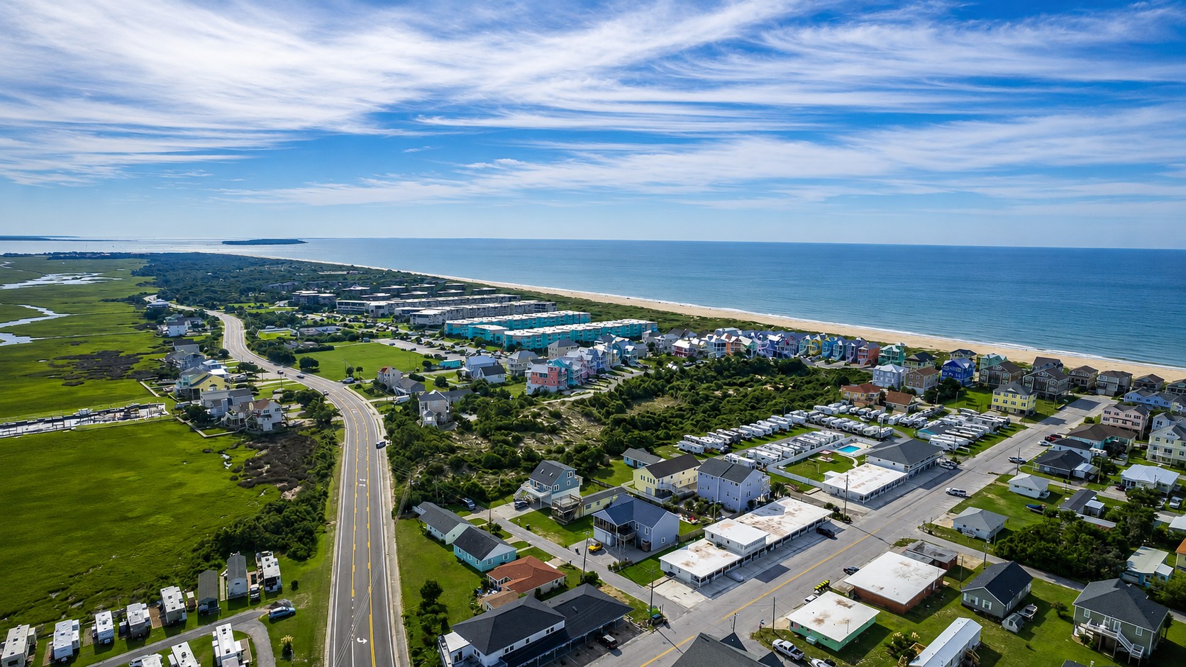 Wide aerial view of Atlantic Beach, the ocean, and surrounding homes