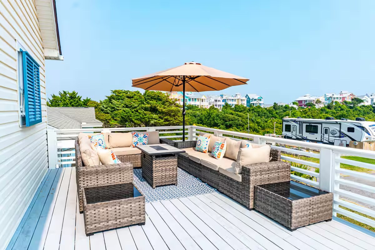 Upper deck with wicker sectional and umbrella