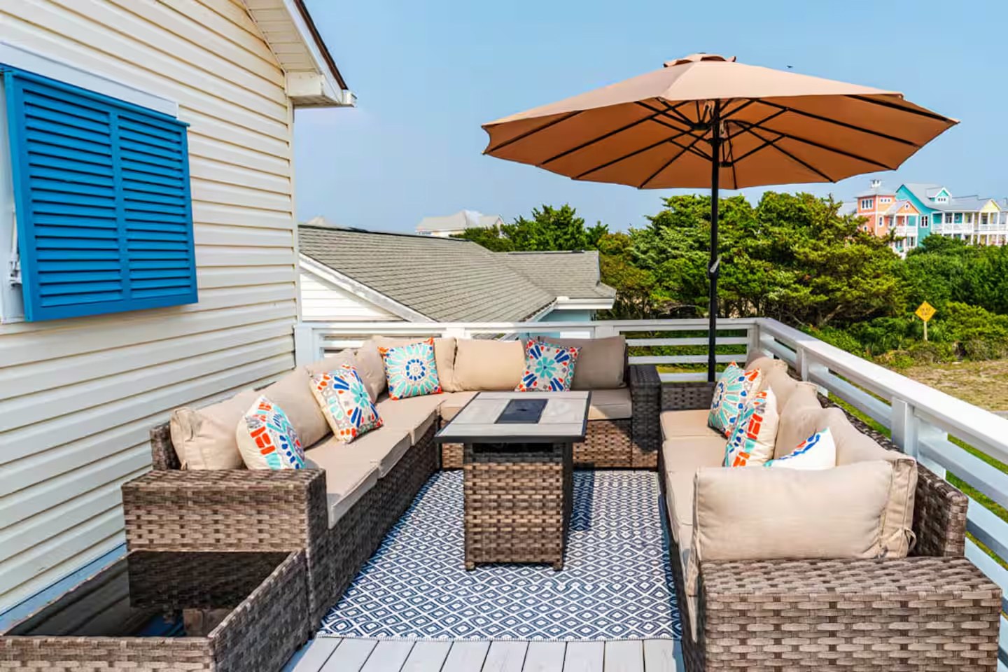 Upper deck sectional with view of colorful beach houses