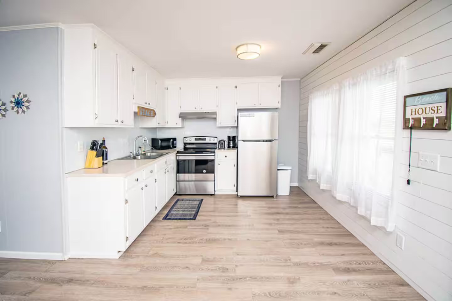 Kitchen with white cabinets and stainless steel appliances