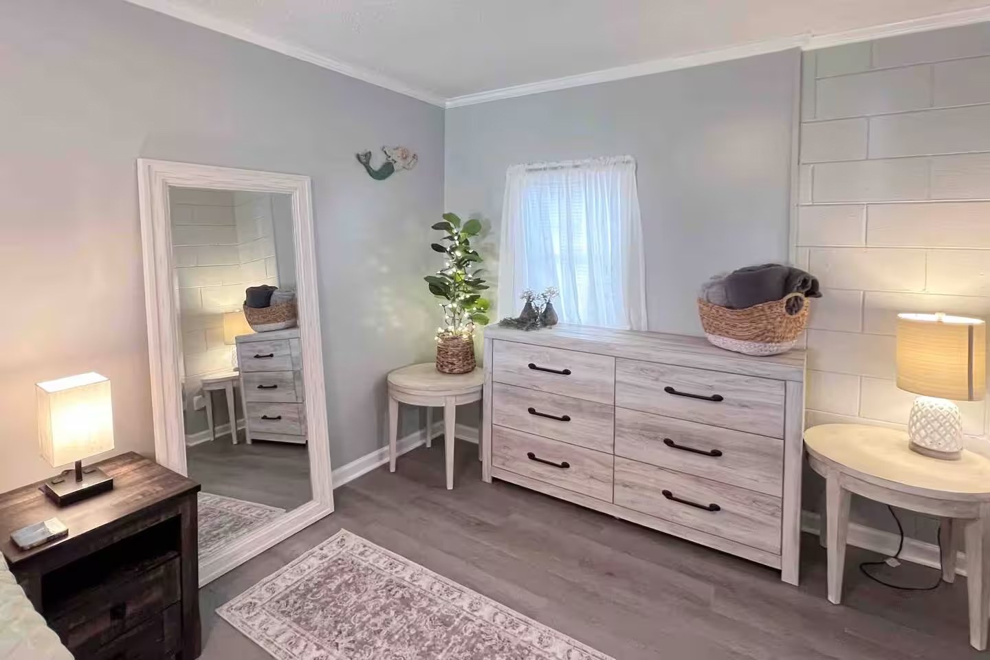 Queen bedroom dresser with mirror and potted plant