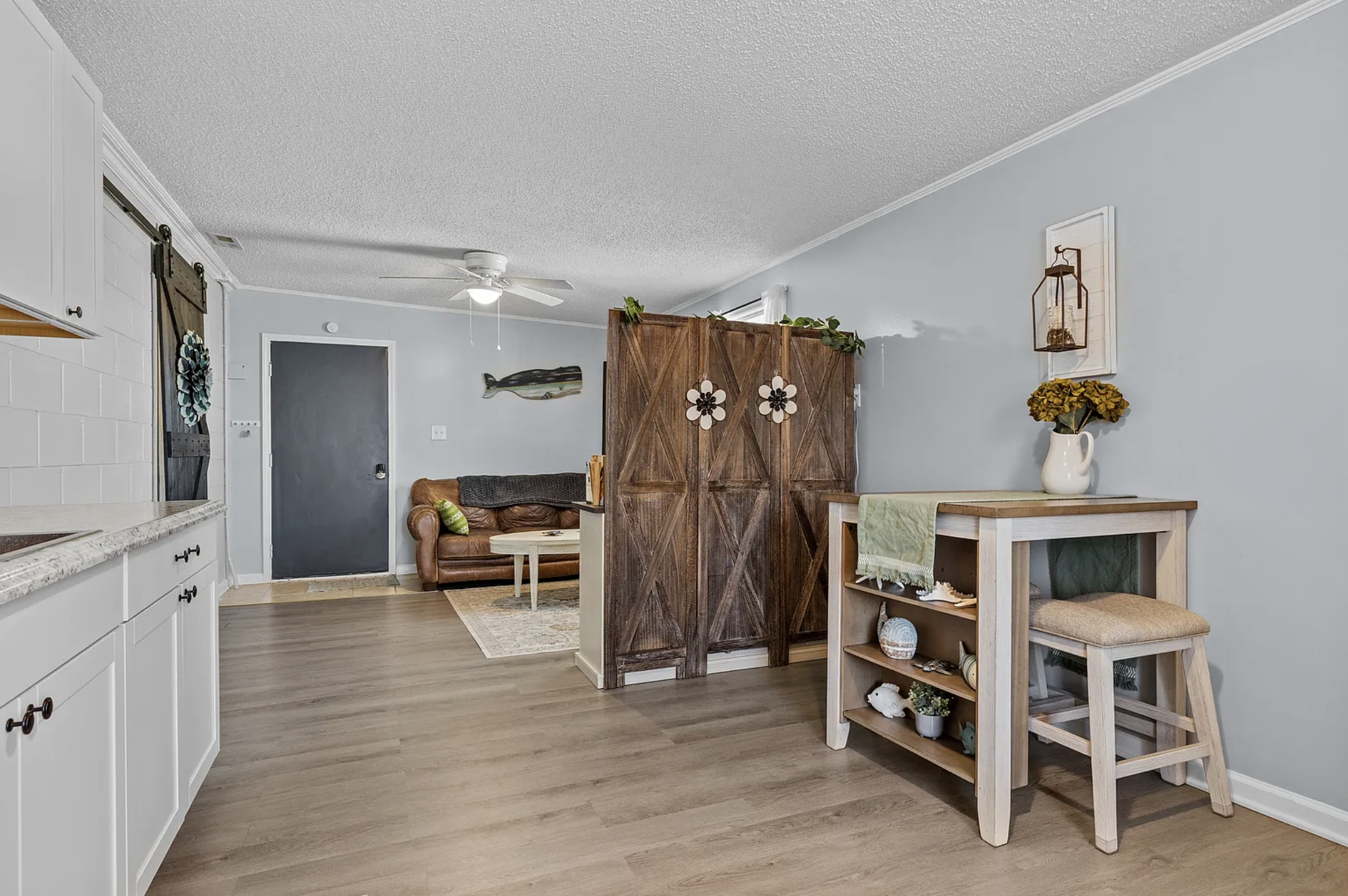Dining and workspace nook with barn doors and built-in shelving